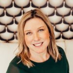 A person poses for a headshot.