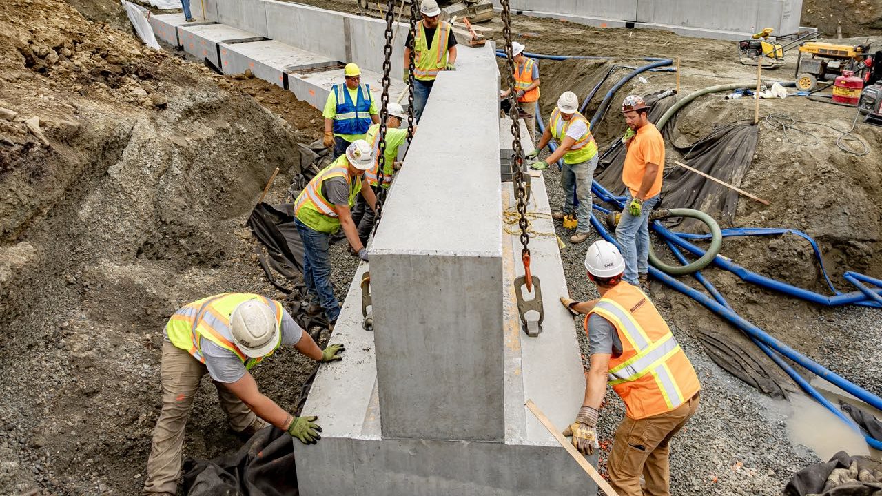 People work on construction outside.