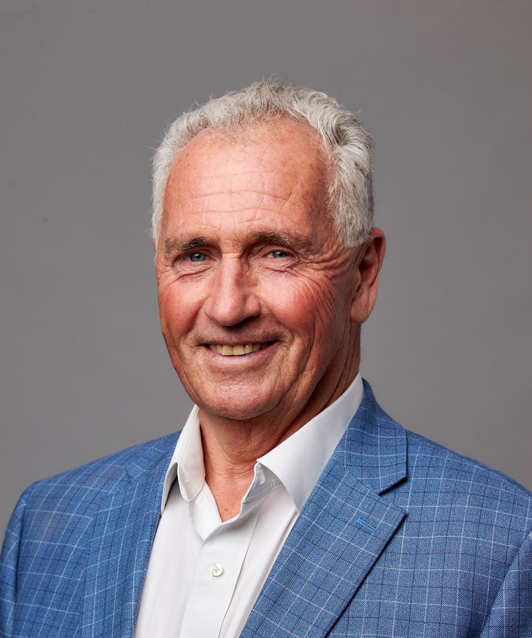 A person poses for a headshot.