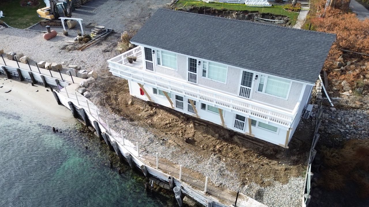 A buliding along the waterfront is seen from the air.