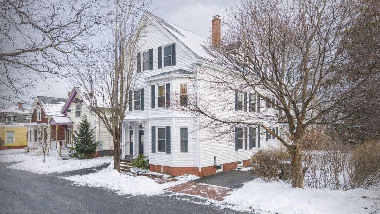 A house has white siding.