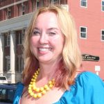 A person poses for a headshot.