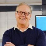 A person poses for a headshot.