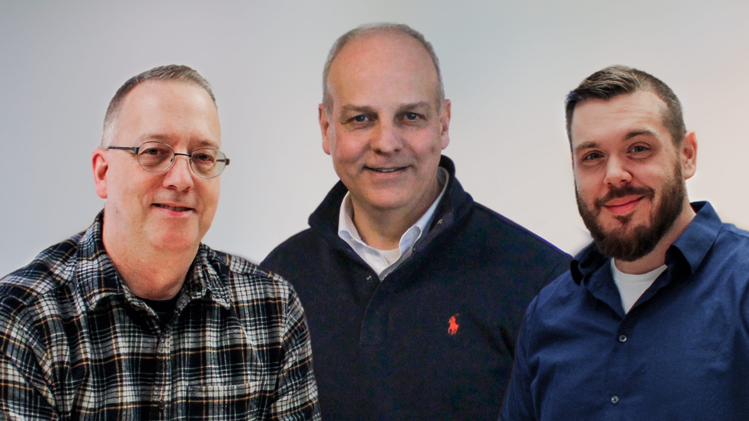 Three people pose for a photo.