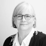 A person poses for a headshot.