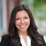 A person poses for a headshot.