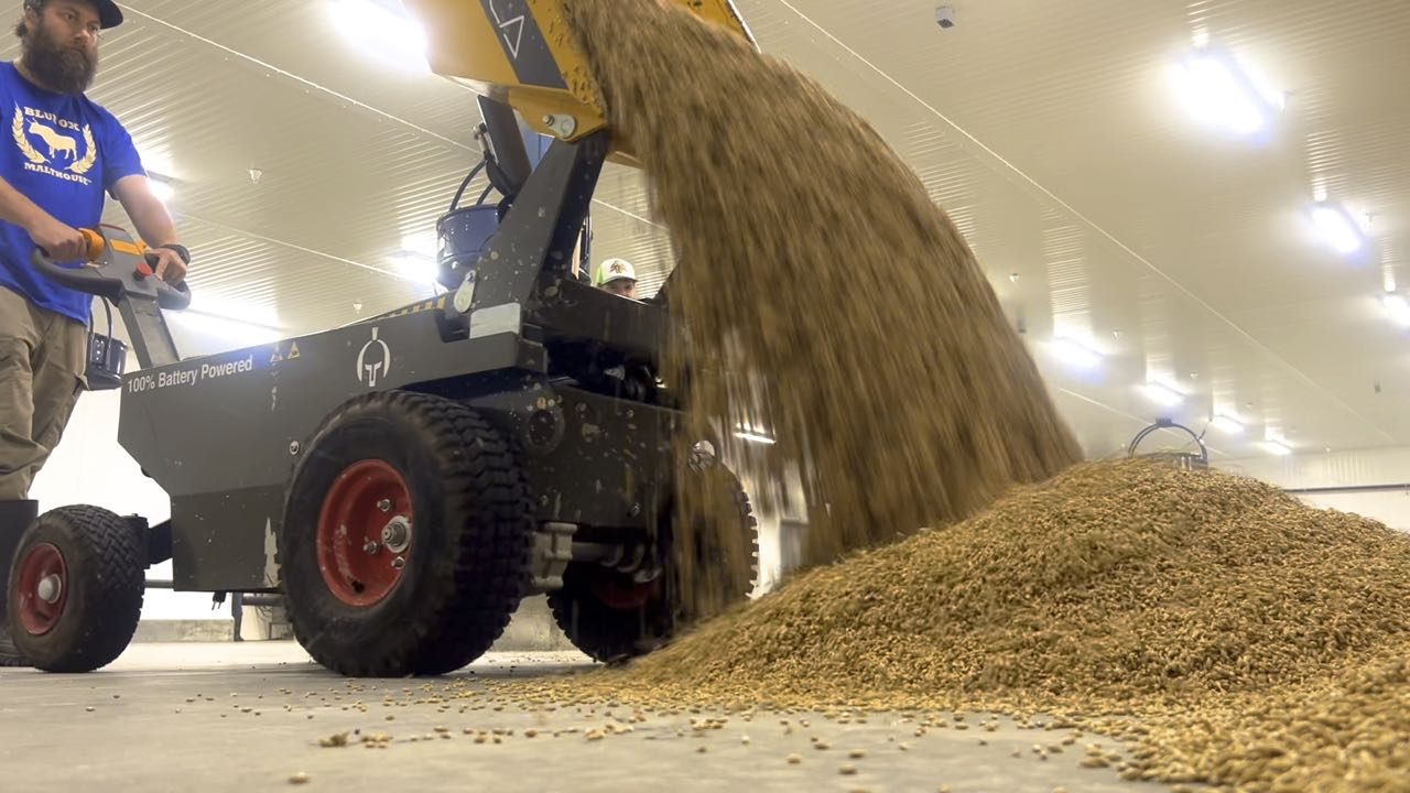 Grains are poured onto the floor.