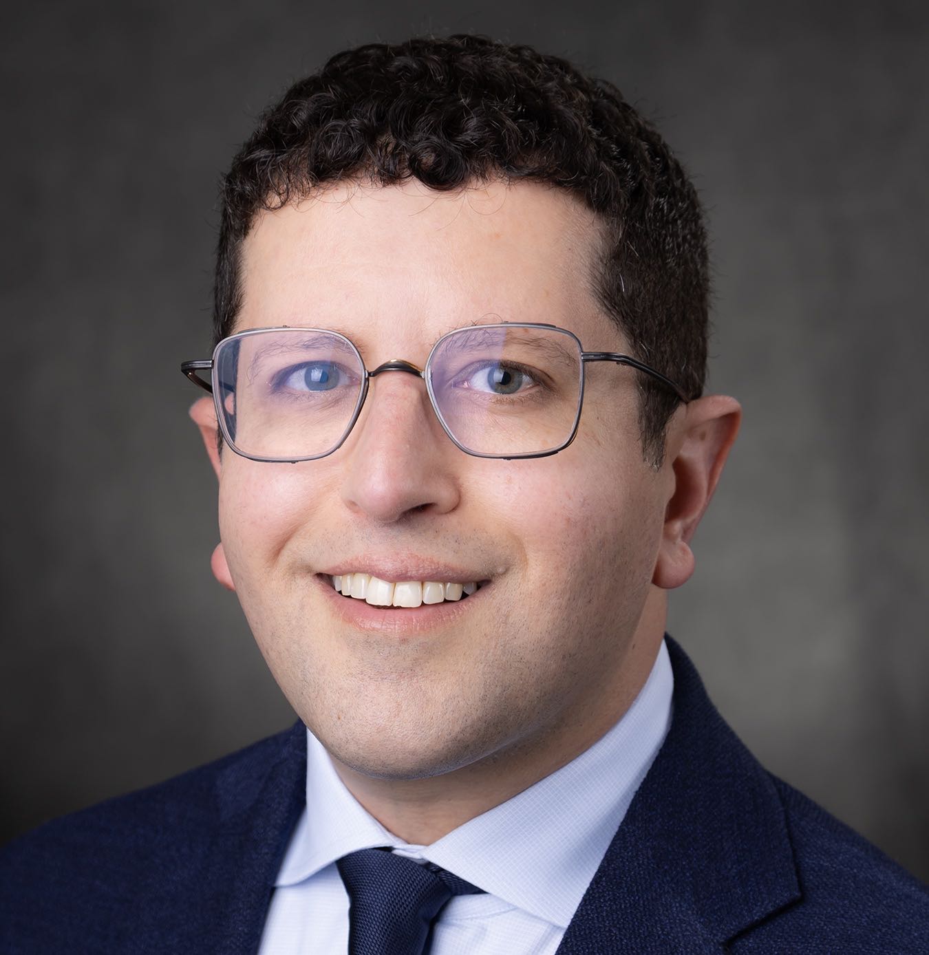 A person poses for a headshot.