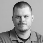 A person poses for a headshot.