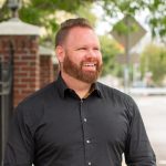 A person poses for a headshot.