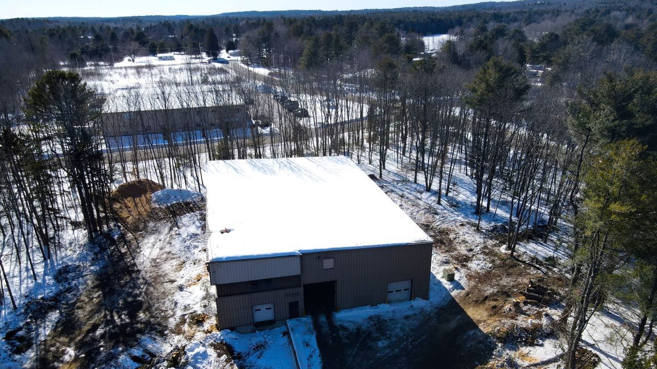 A building has a clearing around it.