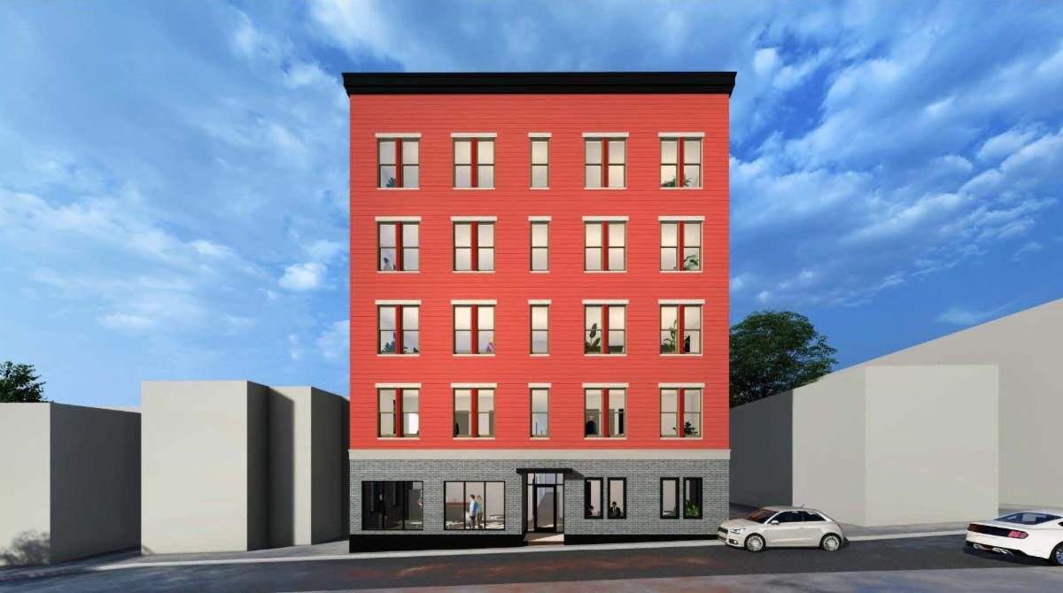 A multi-story building with a red facade.