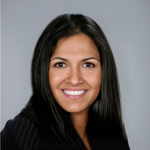 A person poses for a headshot.