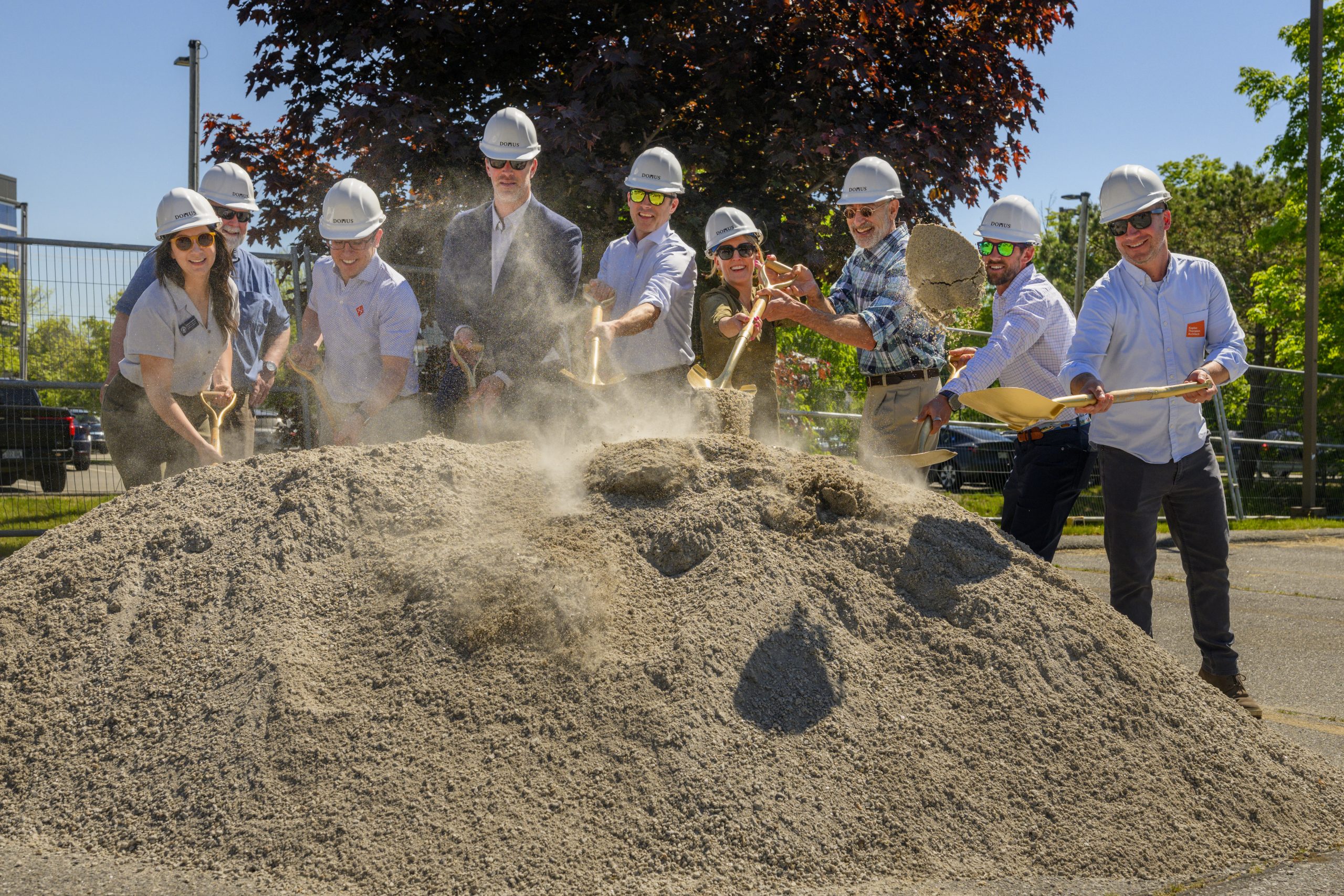 people shovelling at a groundbreaking