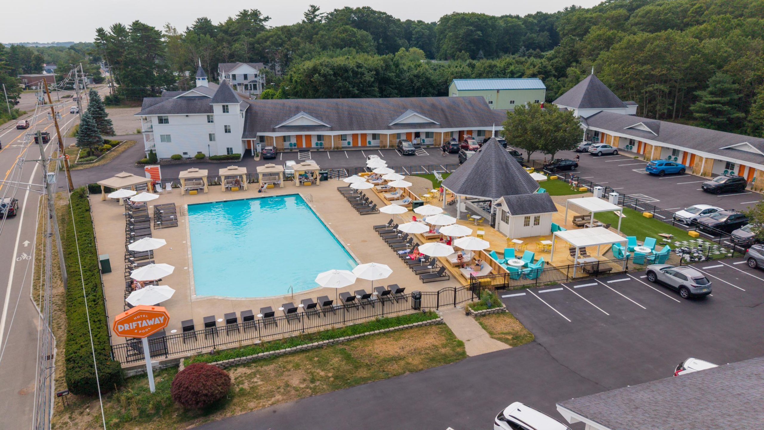 An aerial view of a pool and budilings.