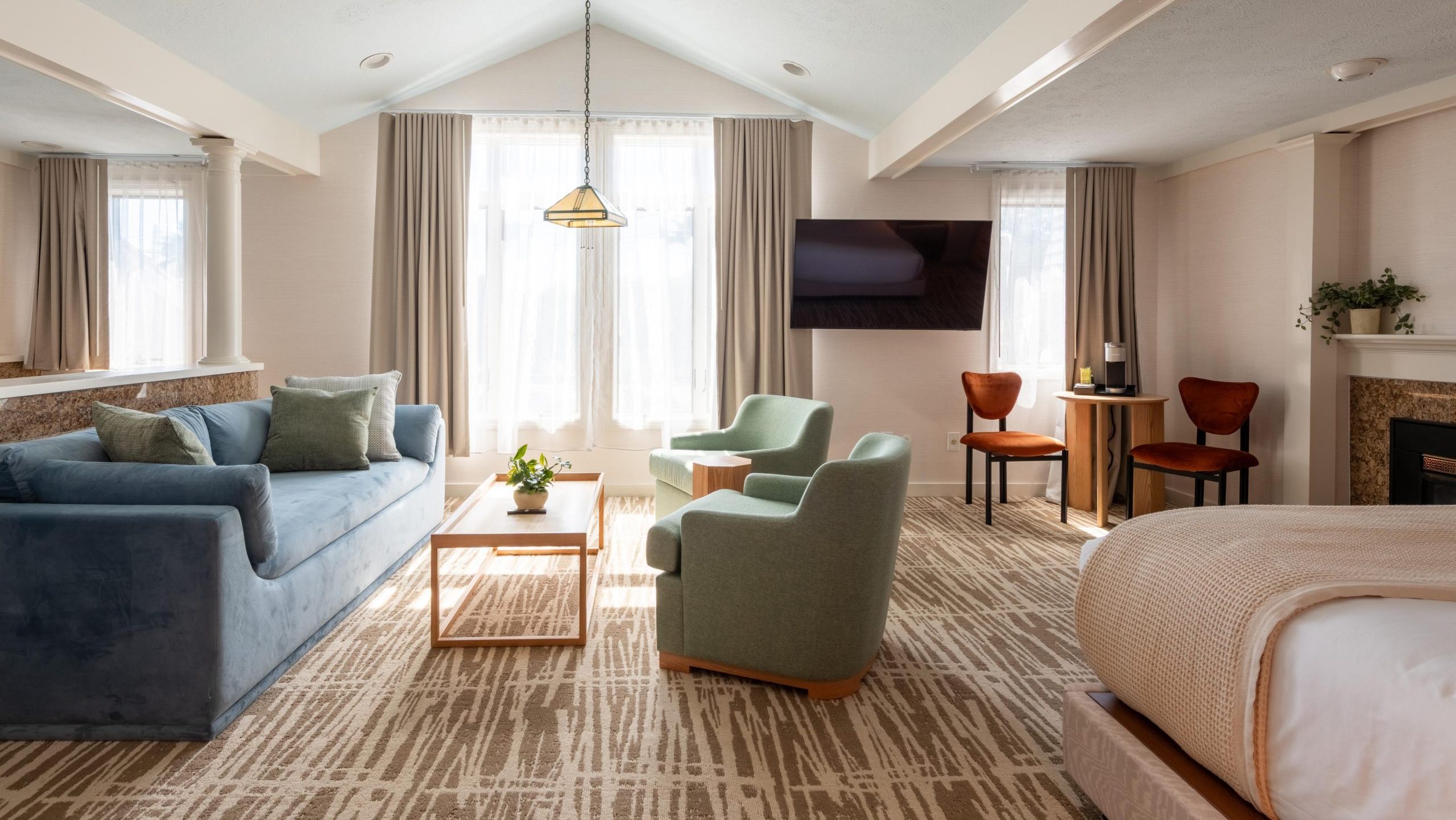 A hotel room has a bed.
