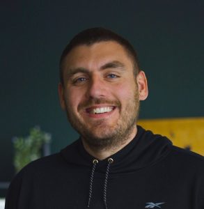 A person poses for a headshot.