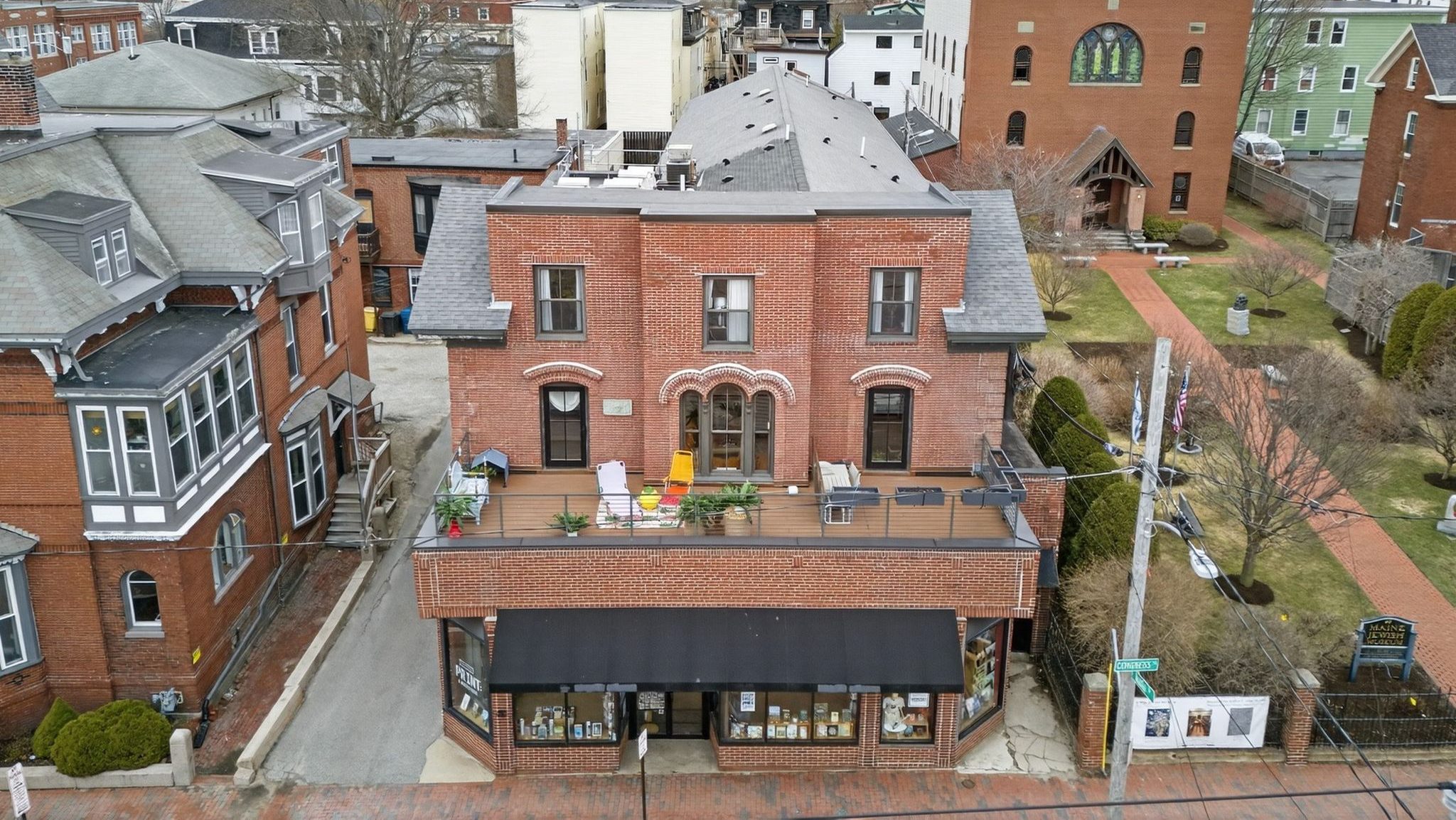 An aerial view of a building with a long deck.