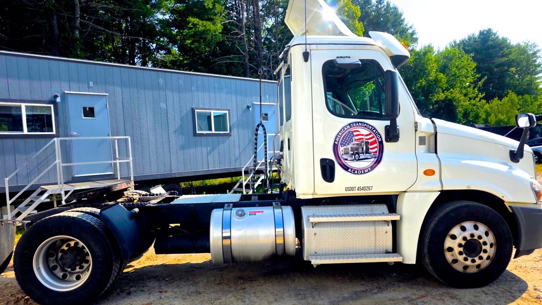 A tractor is parked in a yard.