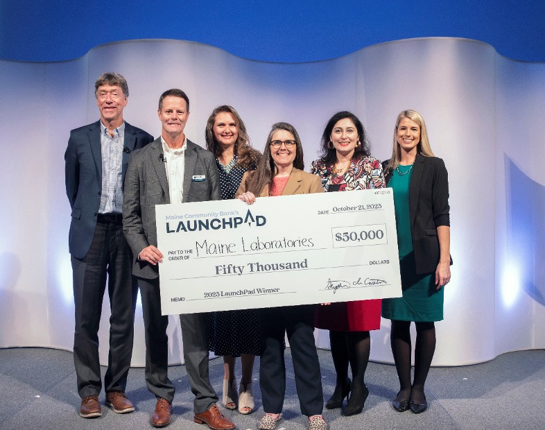 LaunchPad winner and judges on stage, 2025